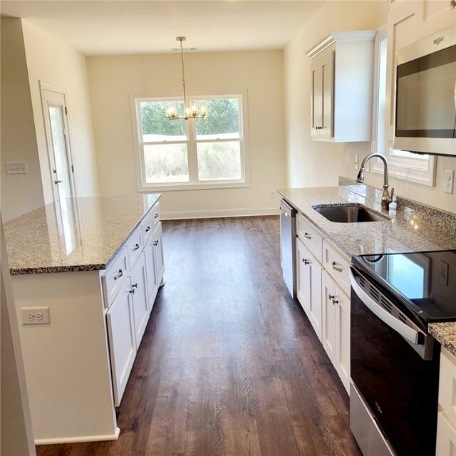 705 Riverside Ests, Lanett, AL 36863 - kitchen featuring a sink, dark wood-style floors, light stone countertops, and stainless steel appliances