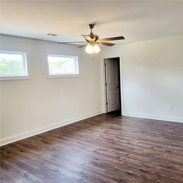 705 Riverside Ests, Lanett, AL 36863 - unfurnished room with dark wood-style floors, visible vents, a wealth of natural light, and baseboards