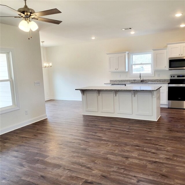 705 Riverside Ests, Lanett, AL 36863 - kitchen with white cabinets, a center island, and stainless steel appliances