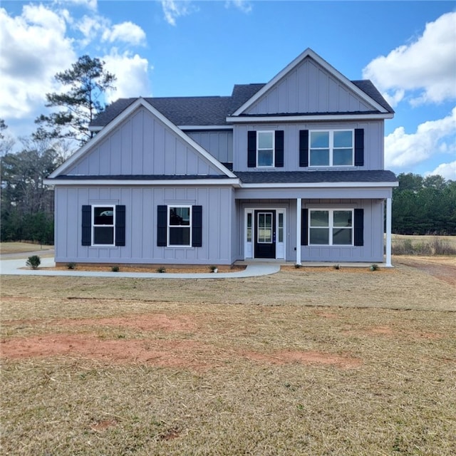 705 Riverside Ests, Lanett, AL 36863 - view of front of property with board and batten siding, a front yard, and a shingled roof