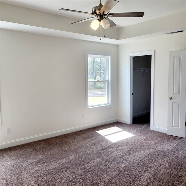 705 Riverside Ests, Lanett, AL 36863 - unfurnished bedroom featuring visible vents, a ceiling fan, a closet, carpet flooring, and baseboards