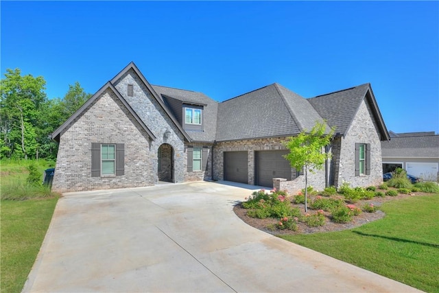 1637 James Burt Pkwy, Auburn, AL 36830 - french provincial home with an attached garage, driveway, brick siding, and a front lawn