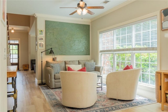 1714 Vfw Rd, Auburn, AL 36830 - living area featuring ornamental molding, a ceiling fan, and wood finished floors