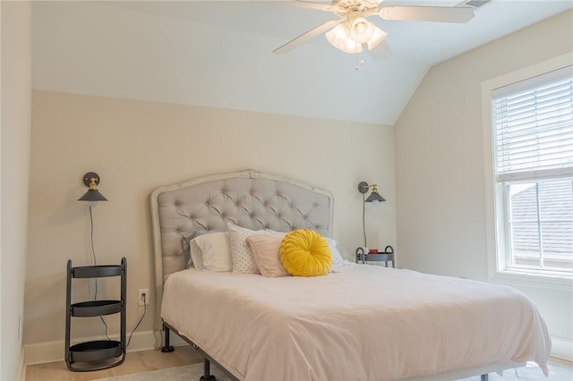 1714 Vfw Rd, Auburn, AL 36830 - bedroom featuring lofted ceiling, multiple windows, baseboards, and ceiling fan