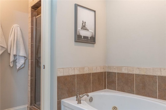 1714 Vfw Rd, Auburn, AL 36830 - bathroom featuring a stall shower and a tub with jets