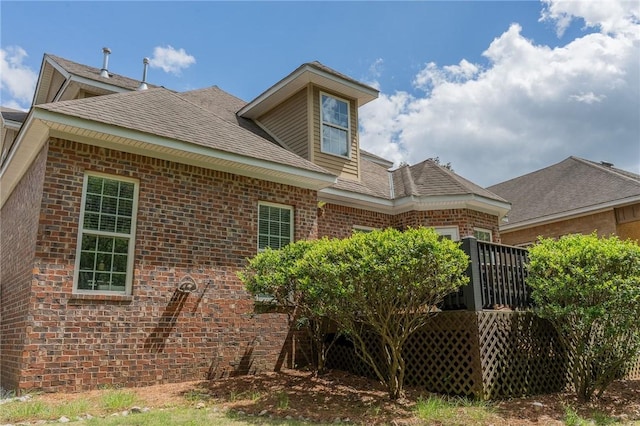 1714 Vfw Rd, Auburn, AL 36830 - rear view of house with brick siding, a shingled roof, and a wooden deck