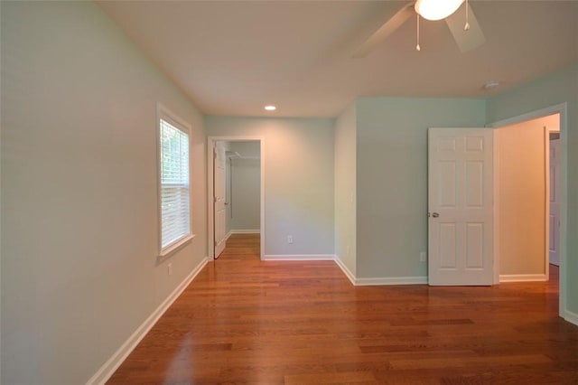 unfurnished room featuring wood finished floors, ceiling fan, baseboards, and recessed lighting