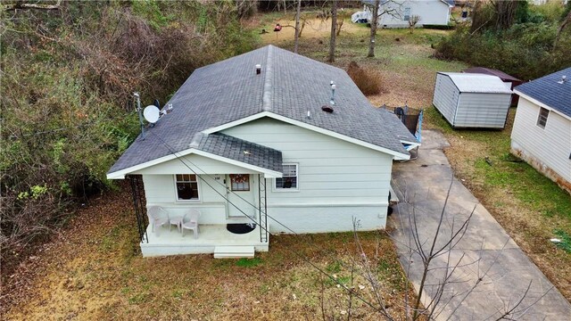 336 Byrd St, Auburn, AL 36832 - rear view of property featuring roof with shingles and an outbuilding