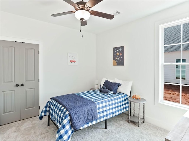 8 Crossing Ct E, Valley, AL 36854 - bedroom with carpet floors, a closet, and a ceiling fan