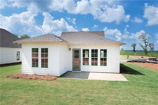 8 Crossing Ct E, Valley, AL 36854 - back of property featuring a shingled roof, a yard, and a patio