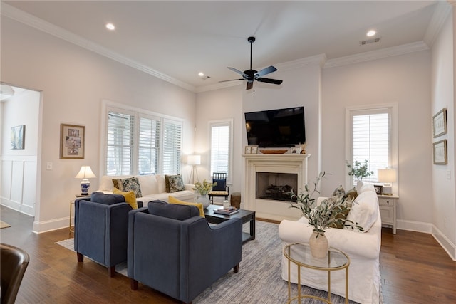 living room featuring crown molding, dark hardwood / wood-style floors, and plenty of natural light