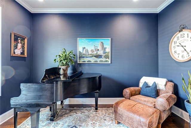 living area featuring crown molding and hardwood / wood-style floors