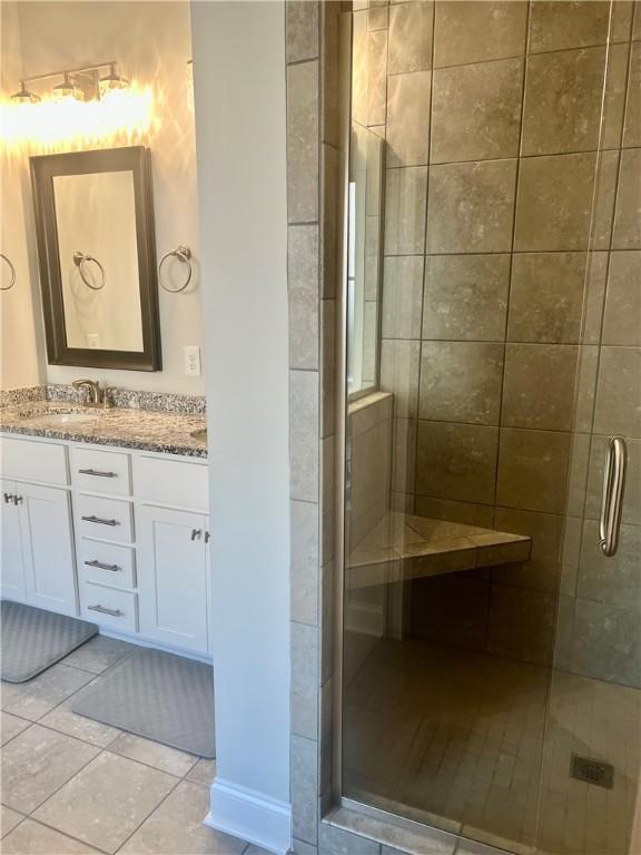 1836 Waterfall Rd, Auburn, AL 36830 - full bath featuring a stall shower, vanity, and tile patterned flooring