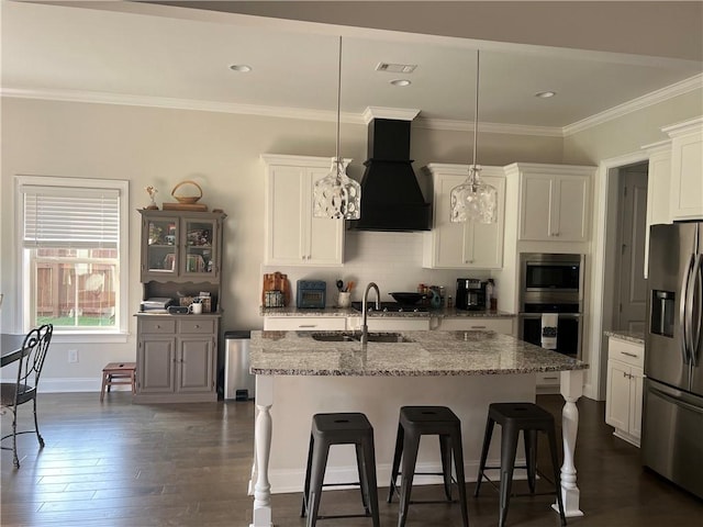 1836 Waterfall Rd, Auburn, AL 36830 - kitchen with appliances with stainless steel finishes, premium range hood, a kitchen bar, white cabinetry, and ornamental molding