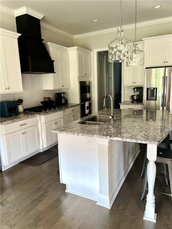 1836 Waterfall Rd, Auburn, AL 36830 - kitchen featuring custom range hood, decorative backsplash, black gas stovetop, a kitchen bar, and a large island with sink
