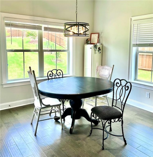 1836 Waterfall Rd, Auburn, AL 36830 - dining area featuring a chandelier, dark wood-type flooring, and plenty of natural light