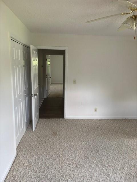 2420 38th Blvd, Valley, AL 36854 - spare room with light colored carpet, baseboards, and ceiling fan