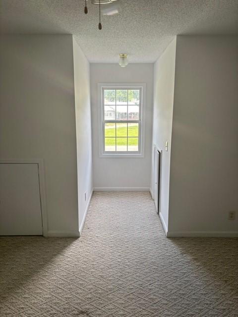 2420 38th Blvd, Valley, AL 36854 - carpeted spare room featuring a textured ceiling and baseboards