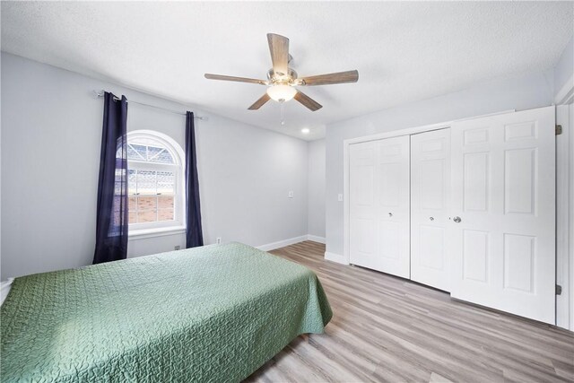 1761 Wire Rd Unit 409, Auburn, AL 36830 - bedroom with wood finished floors, a closet, a ceiling fan, and recessed lighting