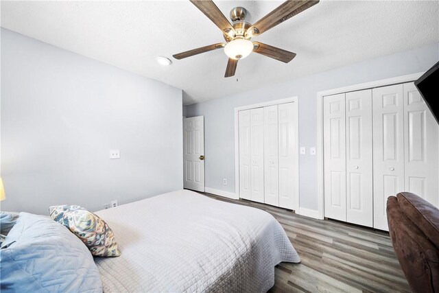 1761 Wire Rd Unit 409, Auburn, AL 36830 - bedroom with two closets, wood finished floors, and ceiling fan