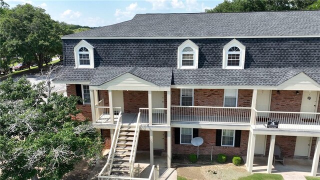 1761 Wire Rd Unit 409, Auburn, AL 36830 - view of front of house featuring brick siding, roof with shingles, and stairway