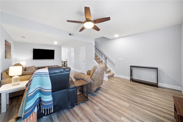 1761 Wire Rd Unit 409, Auburn, AL 36830 - living area featuring stairway, wood finished floors, ceiling fan, and recessed lighting