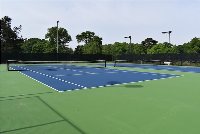 view of sport court with basketball hoop