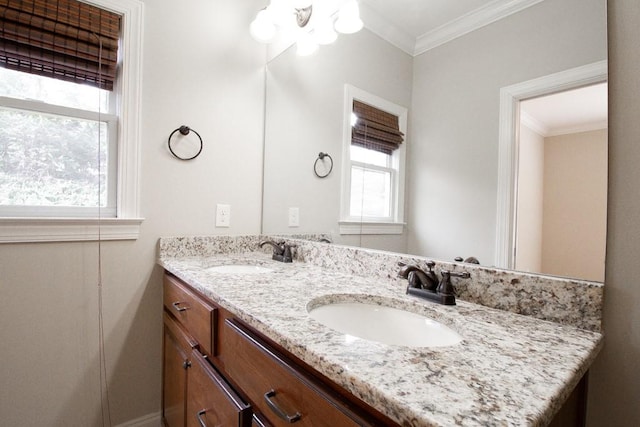 bathroom with vanity and ornamental molding