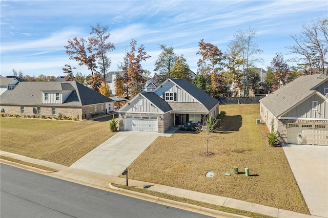 view of front of property featuring a garage and a front yard