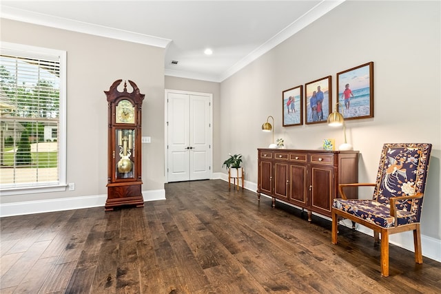 living area with crown molding, baseboards, and dark wood-style flooring
