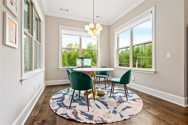 dining space featuring crown molding, baseboards, a notable chandelier, and dark wood-type flooring