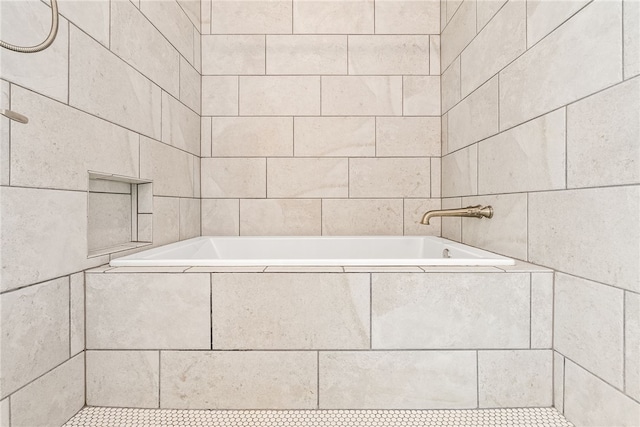 bathroom featuring a relaxing tiled tub