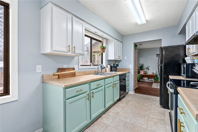 kitchen featuring sink, a textured ceiling, black dishwasher, electric stove, and white cabinets