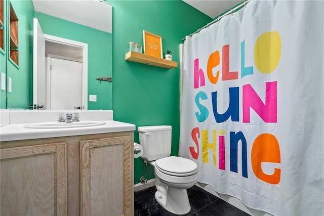 bathroom featuring vanity, toilet, a shower with shower curtain, and a textured ceiling