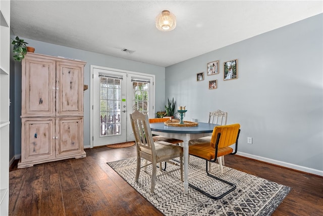 dining room featuring french doors and dark hardwood / wood-style floors