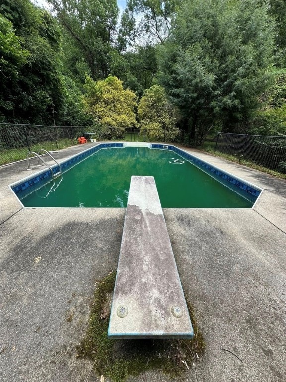 1030 S Gay St, Auburn, AL 36830 - view of swimming pool featuring a diving board and a patio