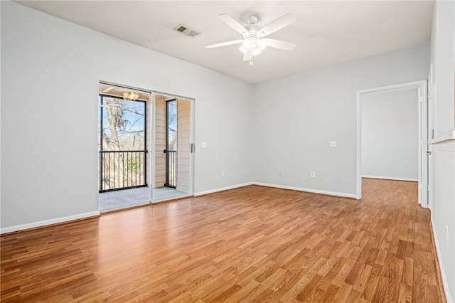 spare room with ceiling fan and light wood-type flooring