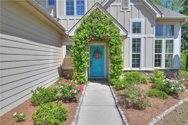 227 Westover St, Auburn, AL 36832 - view of exterior entry featuring board and batten siding and stone siding
