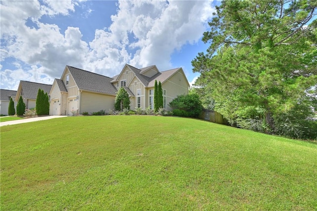 227 Westover St, Auburn, AL 36832 - view of front facade with a garage, driveway, and board and batten siding
