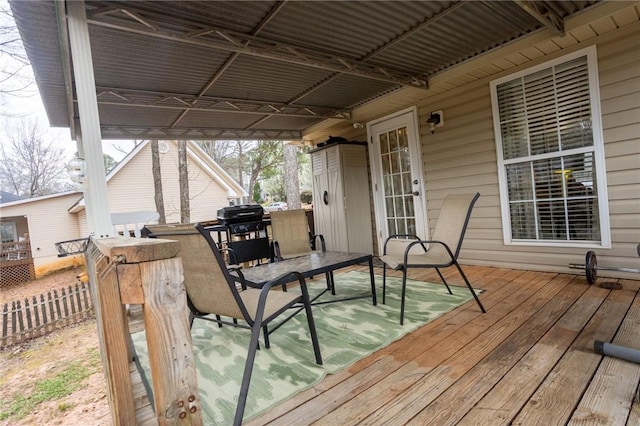 wooden terrace featuring area for grilling