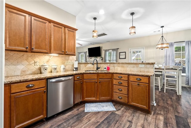 172 Solamere Ln, Auburn, AL 36832 - kitchen featuring dishwasher, a peninsula, brown cabinetry, and dark wood-type flooring