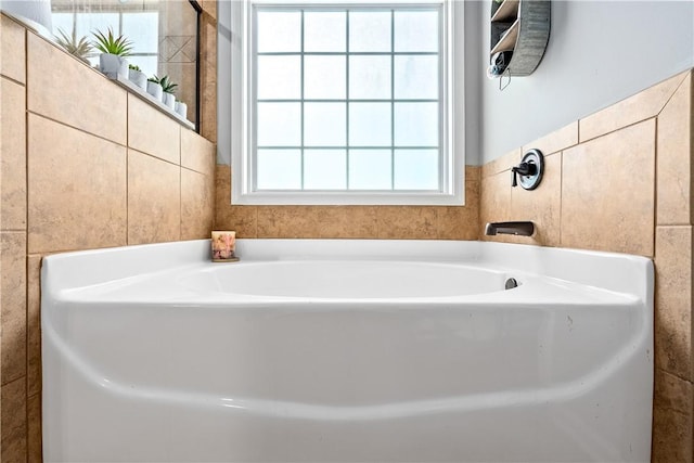 172 Solamere Ln, Auburn, AL 36832 - bathroom featuring a bath and tile walls