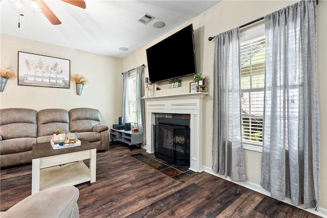 172 Solamere Ln, Auburn, AL 36832 - living area featuring dark wood-type flooring, ceiling fan, and a fireplace with flush hearth
