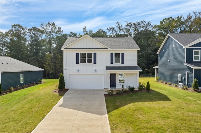 view of front of house with a front lawn and a garage