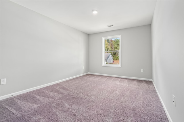 empty room with carpet flooring