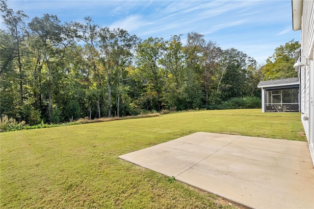 view of yard with a patio area and a sunroom