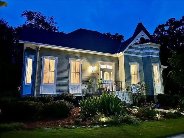 1008 3rd Ave, Opelika, AL 36801 - back of house at twilight featuring covered porch