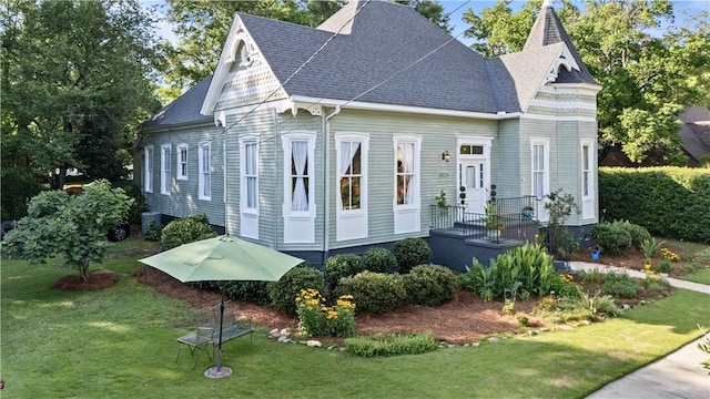 1008 3rd Ave, Opelika, AL 36801 - victorian-style house with a front lawn and roof with shingles