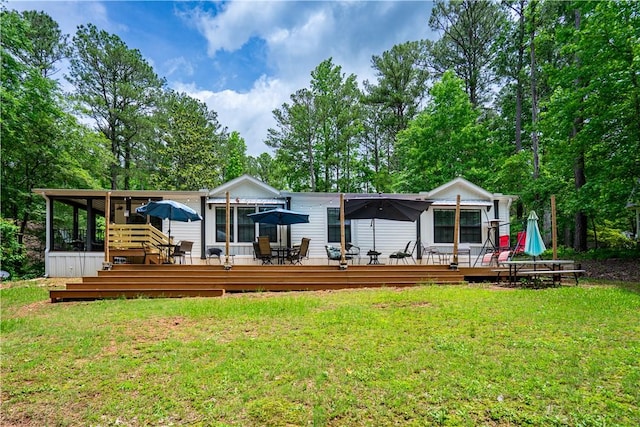 1249 County Road 446, Five Points, AL 36855 - back of house featuring outdoor dining area, a deck, and a yard