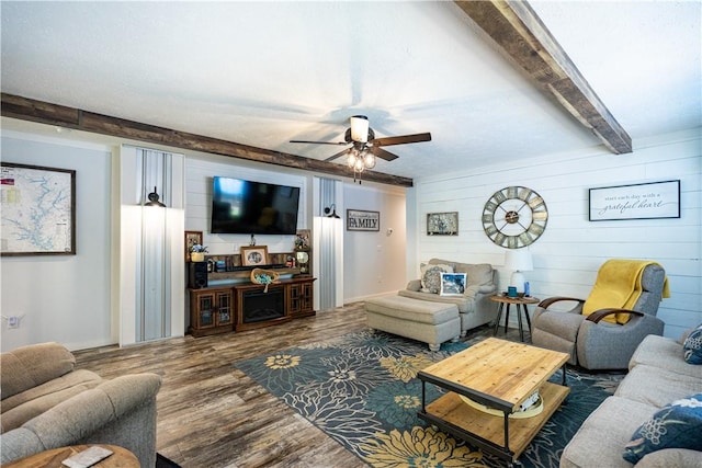 1249 County Road 446, Five Points, AL 36855 - living room with wood finished floors, ceiling fan, beamed ceiling, and wood walls